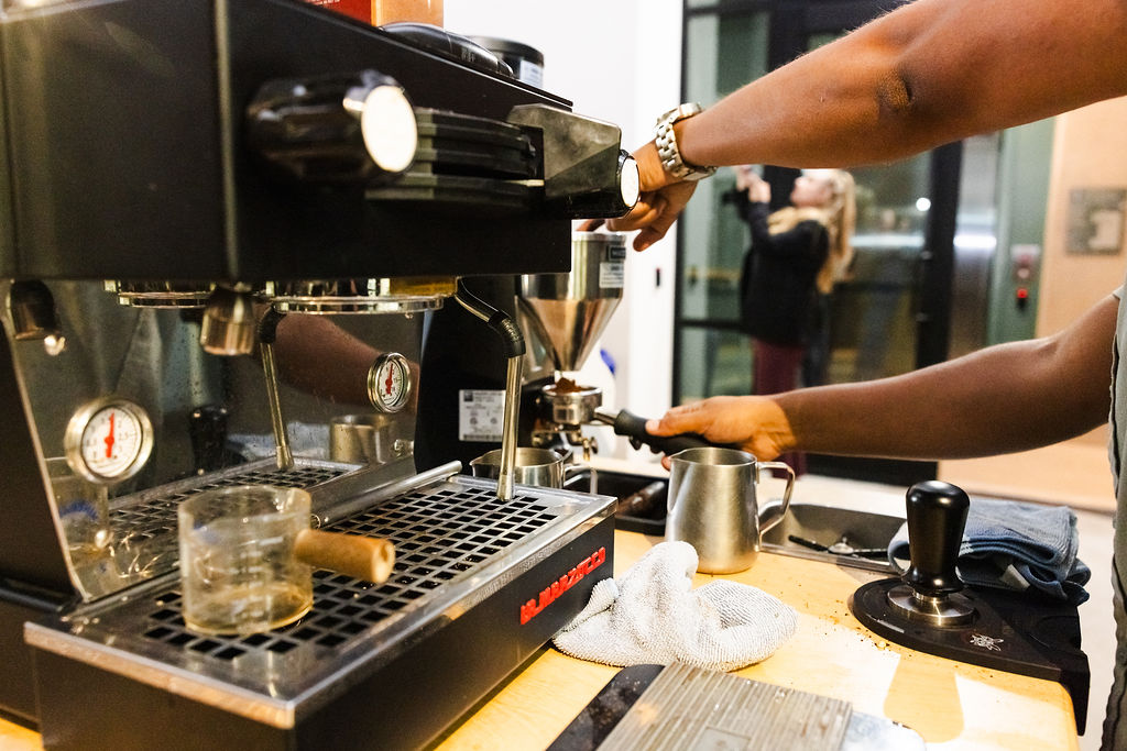 Espresso machine and grinder in coffee bar